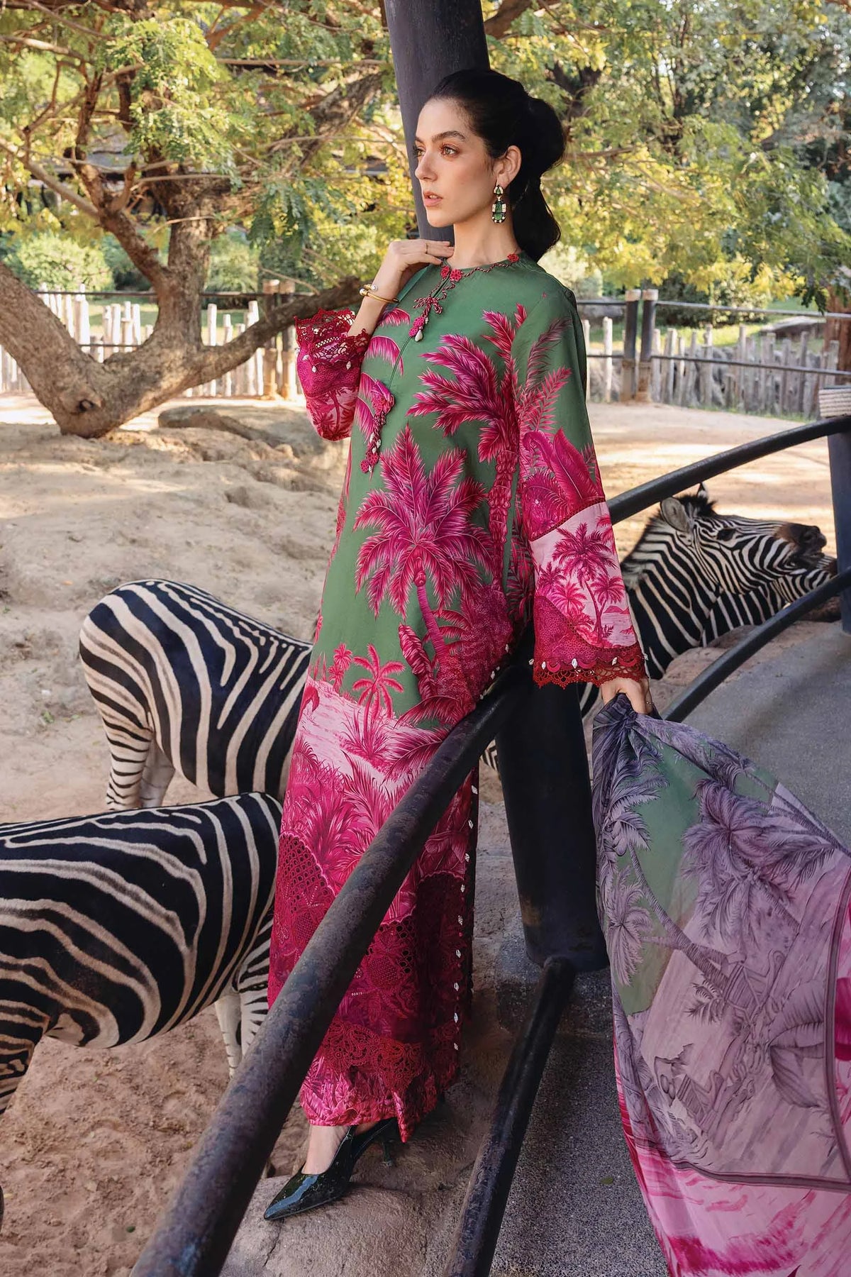 Maria B M Prints Leftover 2-piece traditional dress set with intricate embroidery and vibrant fabric, shown folded on a white background.